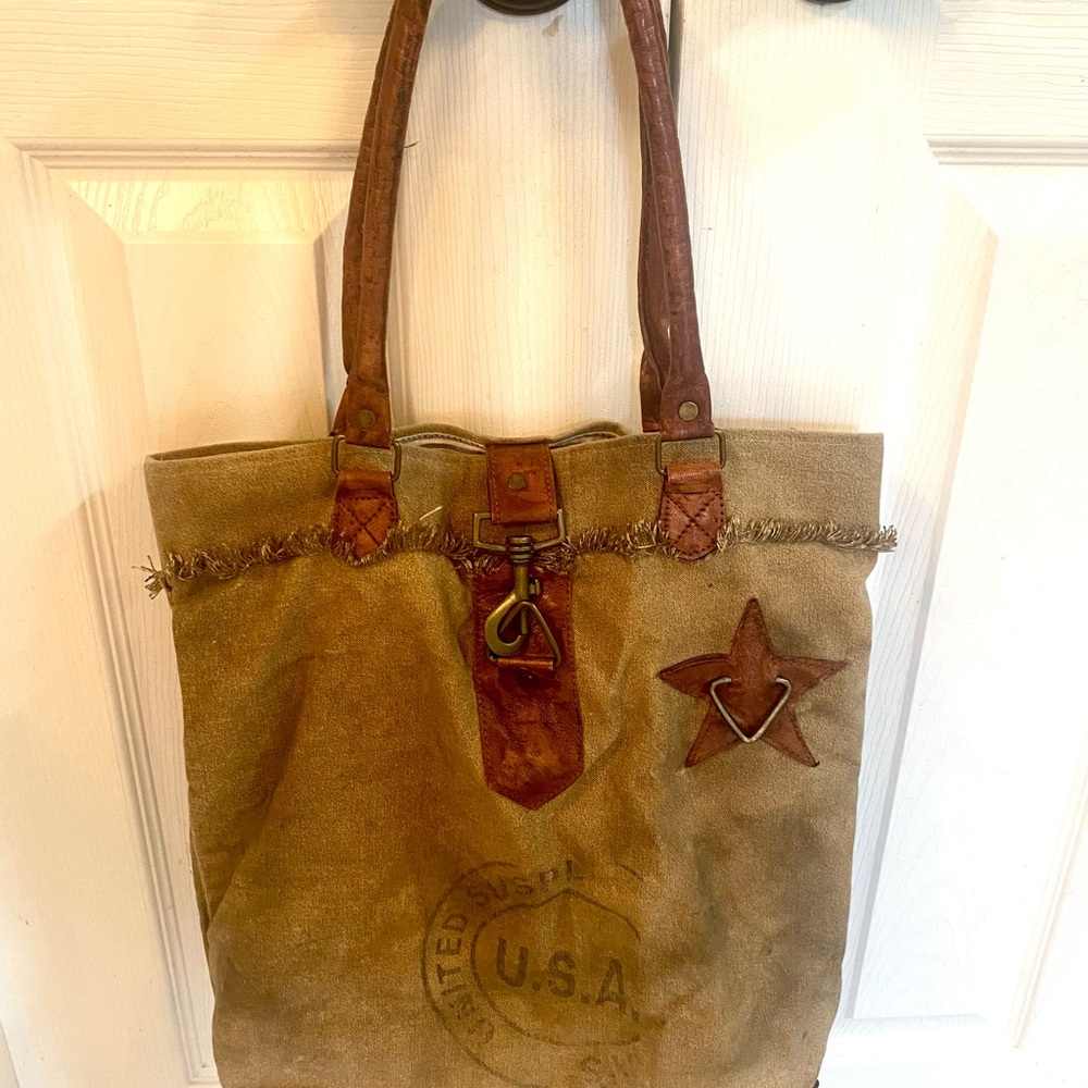Super cool Mona B mail bag tote. Used just a few times. Nonsmoking home.